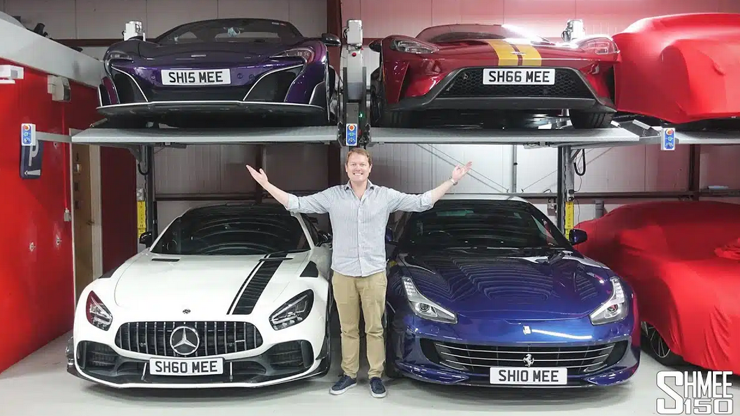 British car influencer Tim Burton infront of super cars stored by light car stackers TP-230H