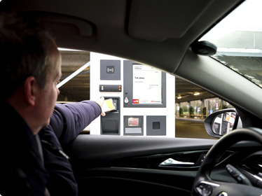 man paying for parking